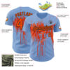 Custom Light Blue Orange-Black Dripping Splatter Paint Authentic Baseball Jersey